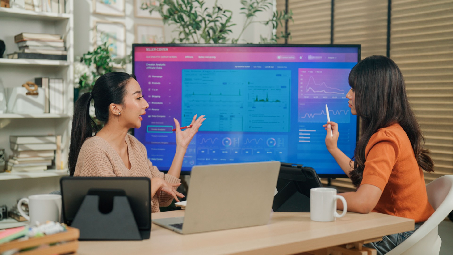Young Asian woman advising her client about starting a new online business.